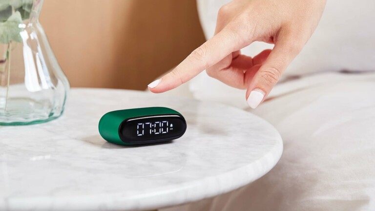Lexon Minut palm-size-design alarm clock is elegant and fits in any bag for travel